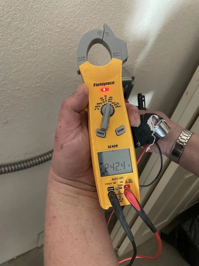 Voltage testing with clamp meter during Outlet Installation in Chapel Hill